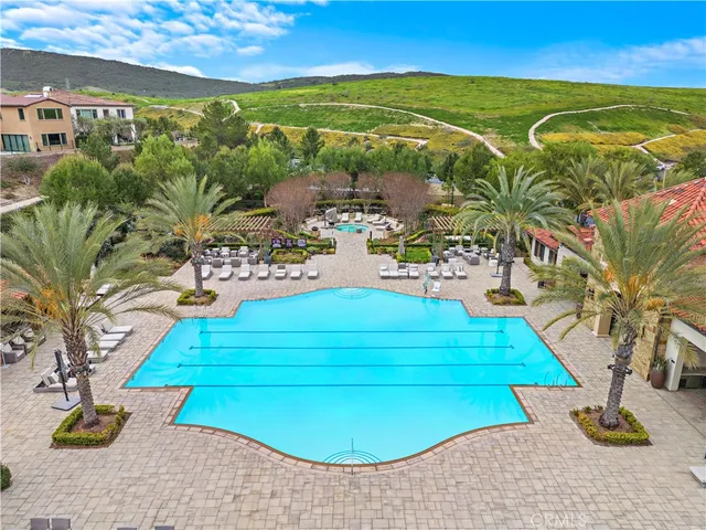 a view of swimming pool outdoor seating and living room