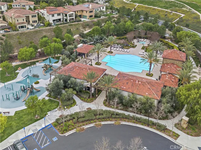 an aerial view of a house with garden space and street view