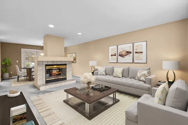 an entryway and livingroom with fireplace