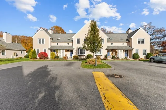 a view of multiple houses with a street