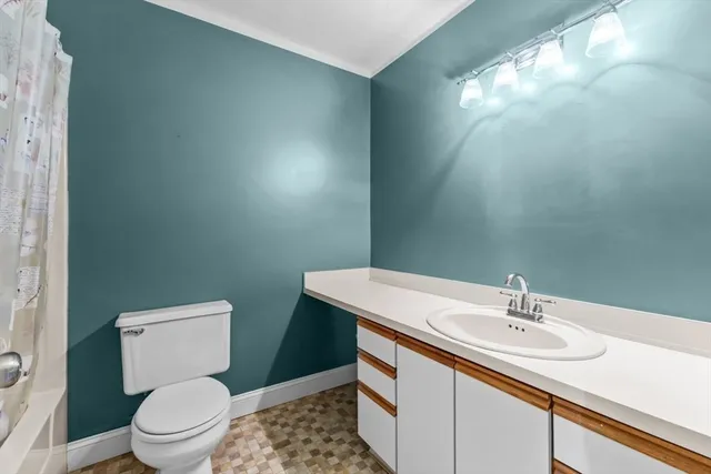 a picture of a bench in front of a wall