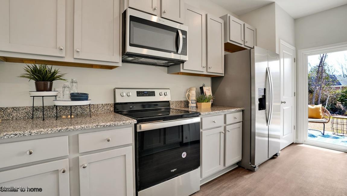 9067 St George Road, Unit LOT 34 Wilmington, NC 28411 - Photo 12 of 57 There are tons of cabinet space in the Kerry kitchen