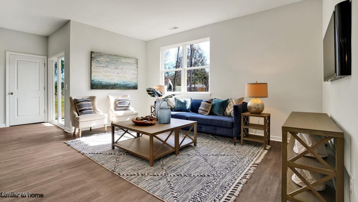 9067 St George Road, Unit LOT 34 Wilmington, NC 28411 - Photo 14 of 57 A bright comfortable living area is big enough for plenty of furniture