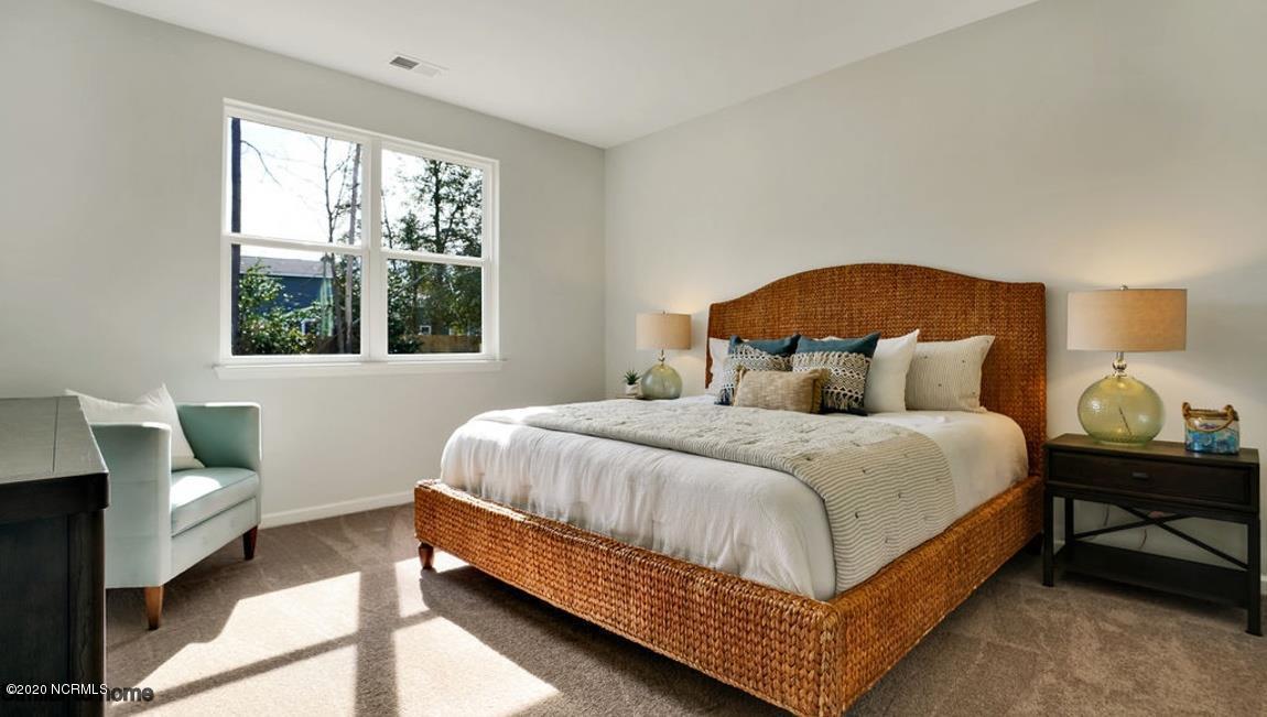 9067 St George Road, Unit LOT 34 Wilmington, NC 28411 - Photo 17 of 57 The owner's suite is large enough for a king bed