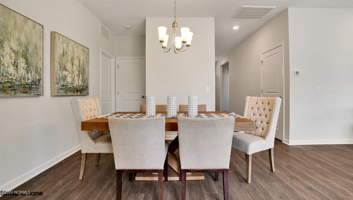 9067 St George Road, Unit LOT 34 Wilmington, NC 28411 - Photo 57 of 57 the Kerry has a large open floor plan with room for a large dining table.