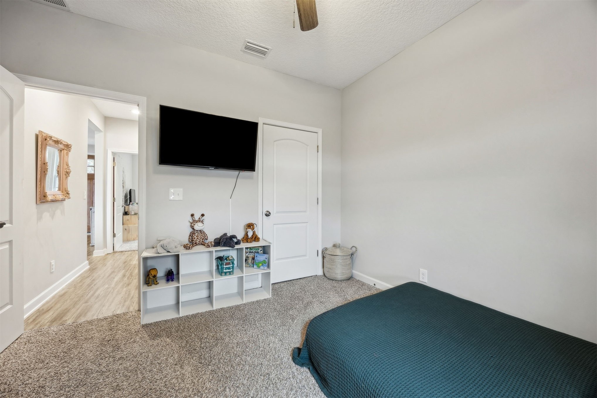 96718 Blackrock Road Yulee, FL 32097 - Photo 44 of 54 a living room with furniture and a flat screen tv
