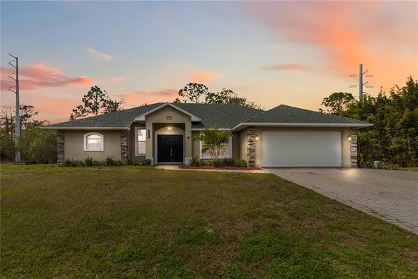 front view of a house with a yard