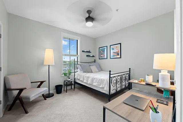 a bathroom with a double vanity sink toilet and shower