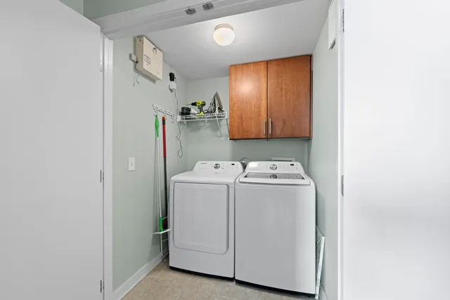 a view of a hallway with windows and entryway