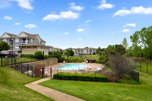 a view of a two chairs in the balcony