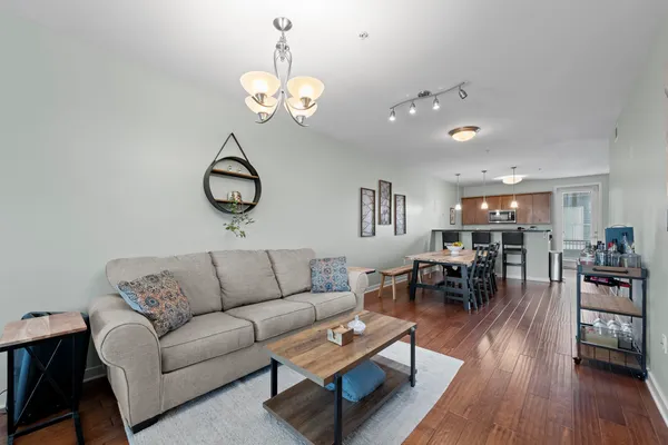 a spacious bedroom with a bed and a flat screen tv