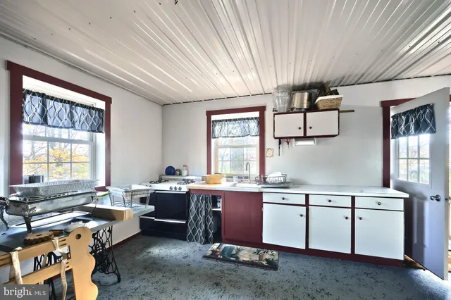 a kitchen with sink cabinets and window