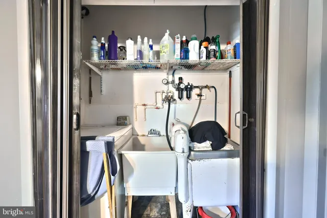 a spacious bathroom with a toilet sink and mirror