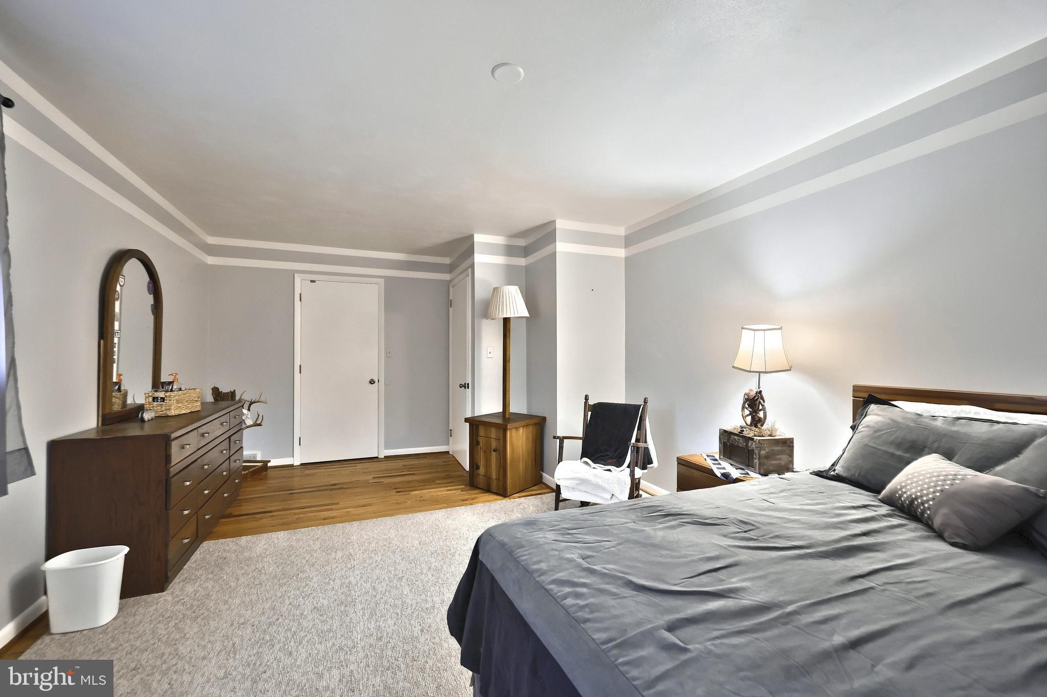 798 Goram Road Brogue, PA 17309 - Photo 48 of 57 a bedroom with a bed and dresser with mirror