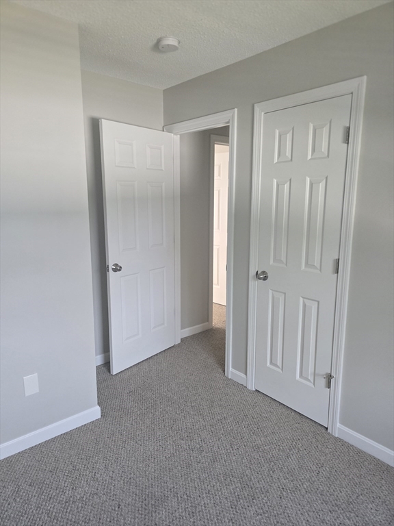 89 Belanger Street, Unit 89 Three Rivers, MA 01080 - Photo 12 of 19 a view of an empty room with closet area