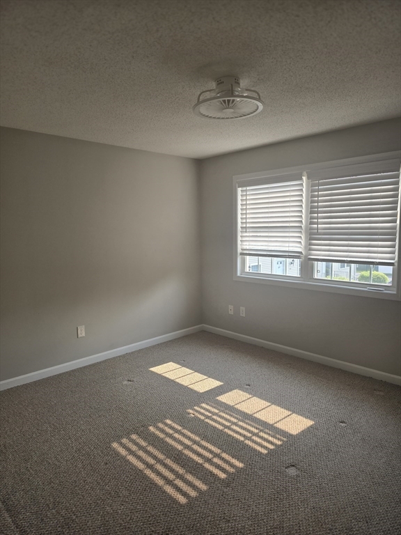 89 Belanger Street, Unit 89 Three Rivers, MA 01080 - Photo 10 of 19 a view of an empty room with a window