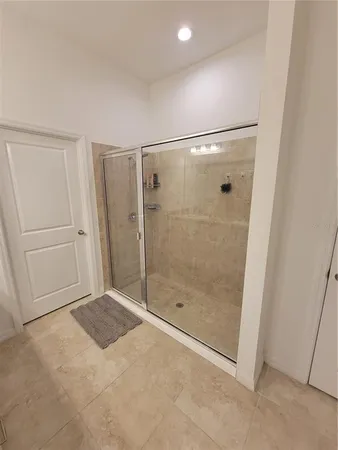 a bathroom with a sink a toilet a mirror and shower curtain