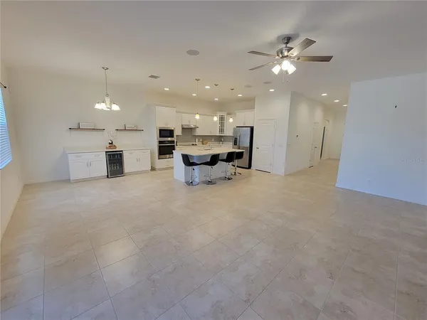 a view of a livingroom with a kitchen