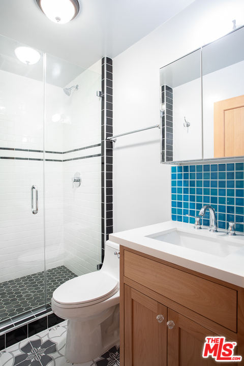 3009 Virginia Road Los Angeles, CA 90016 - Photo 7 of 8 a bathroom with a sink a toilet and shower