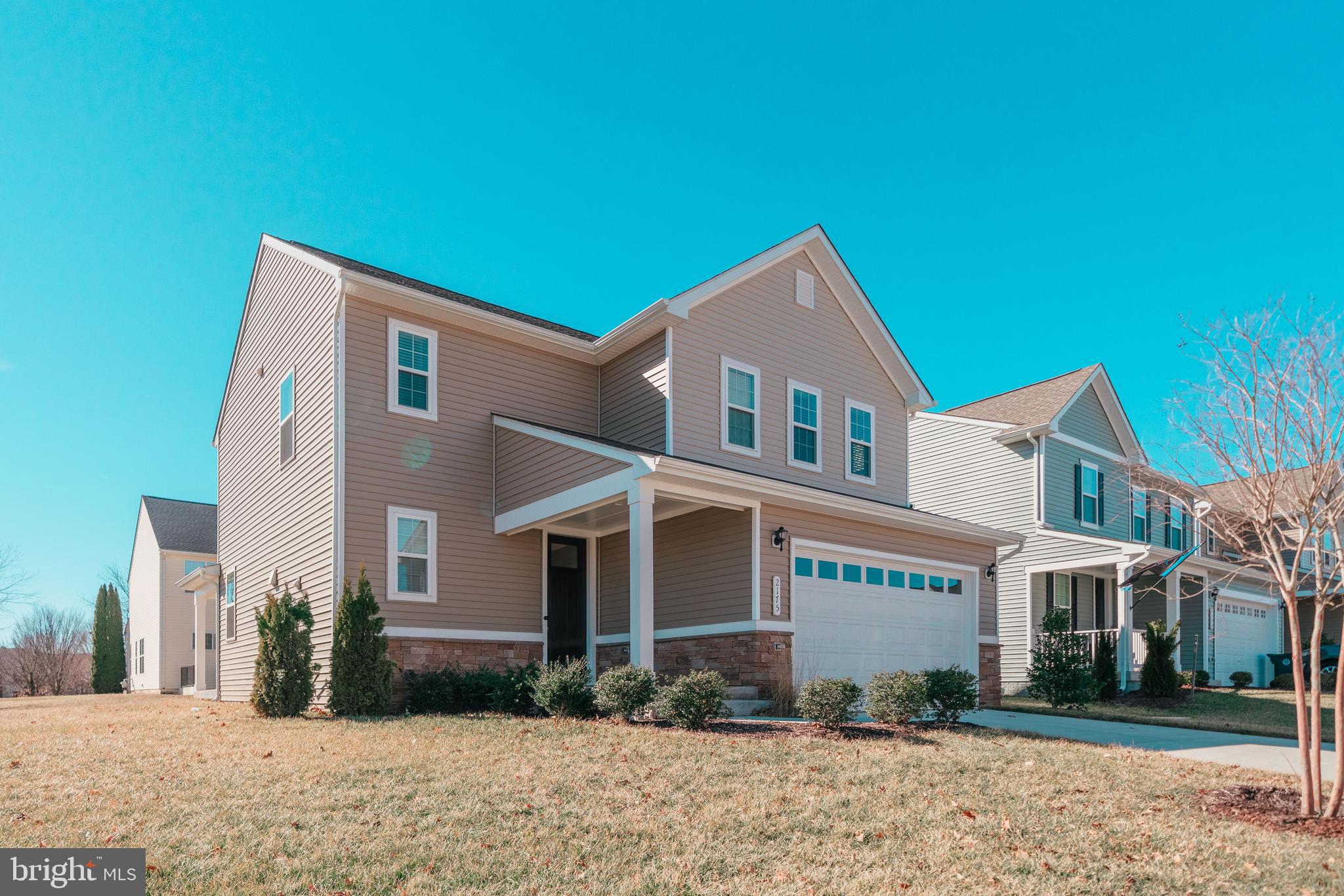 2175 Juniper Drive Culpeper, VA 22701 - Photo 1 of 34 a front view of a house with a yard