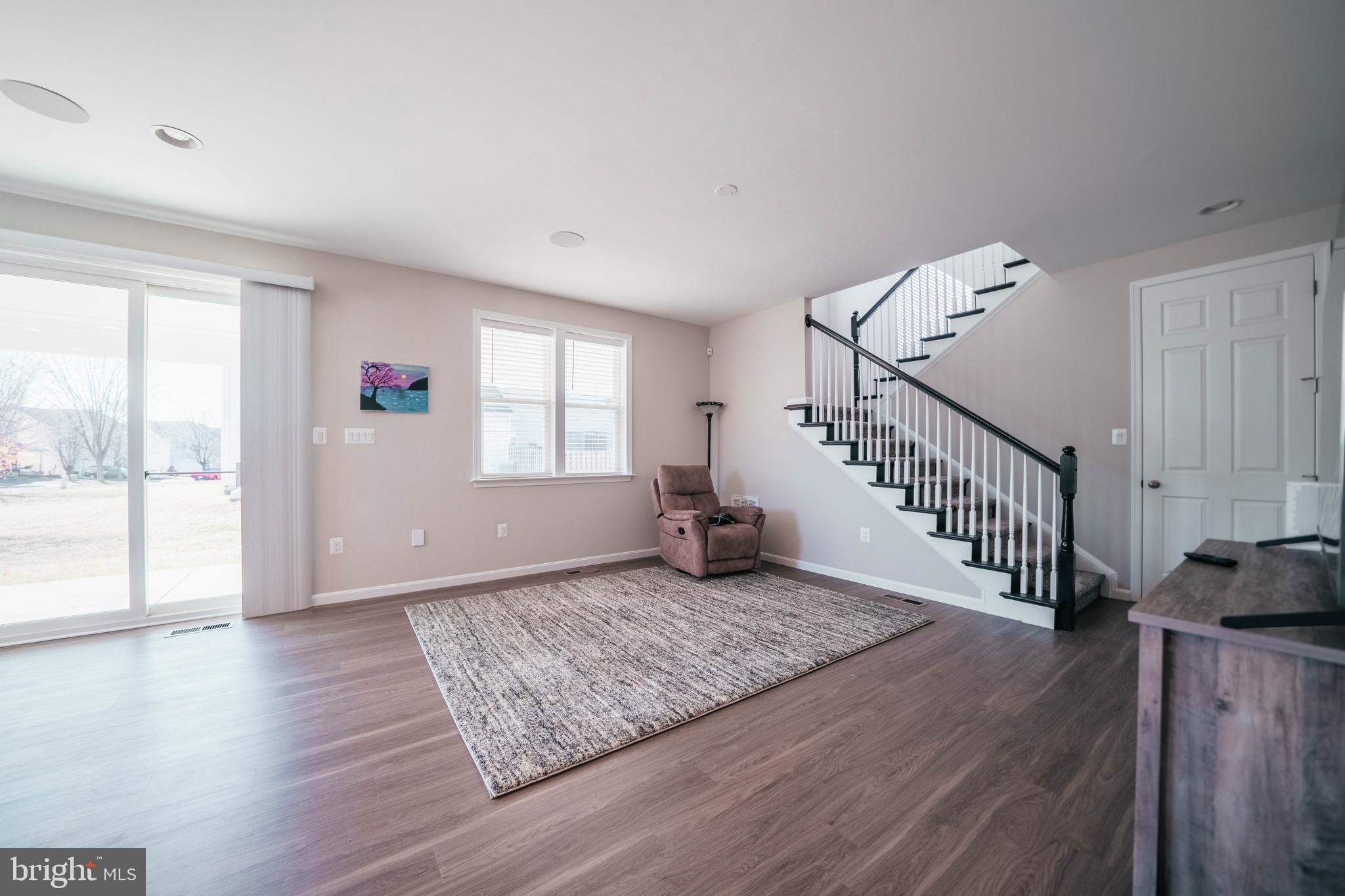 2175 Juniper Drive Culpeper, VA 22701 - Photo 11 of 34 a view of a livingroom with wooden floor and stairs