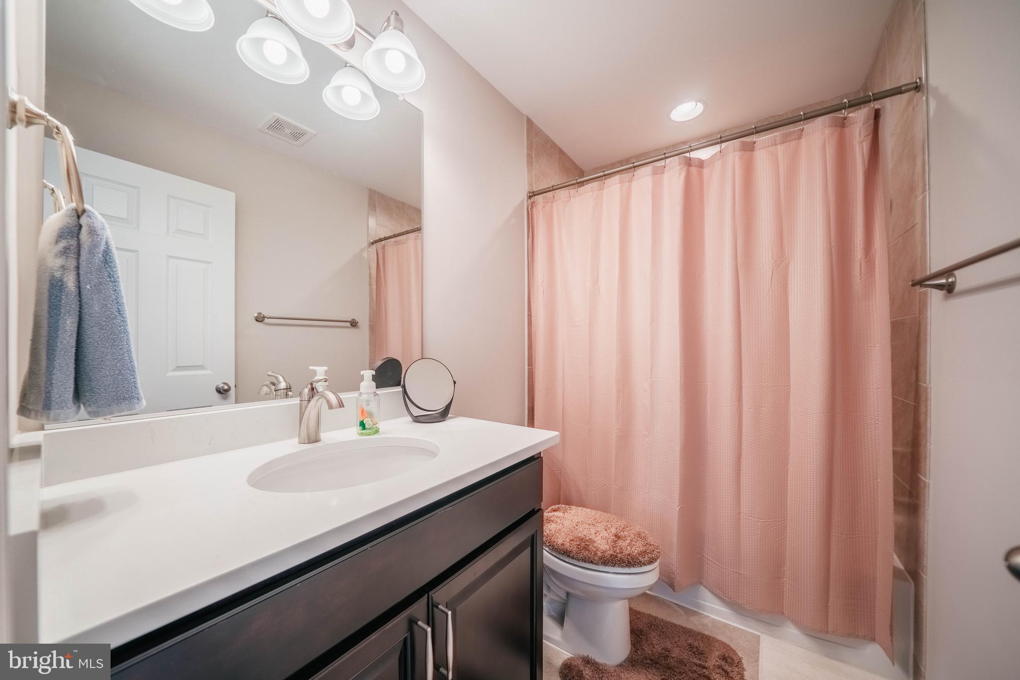 2175 Juniper Drive Culpeper, VA 22701 - Photo 15 of 34 a bathroom with a sink a toilet and a mirror