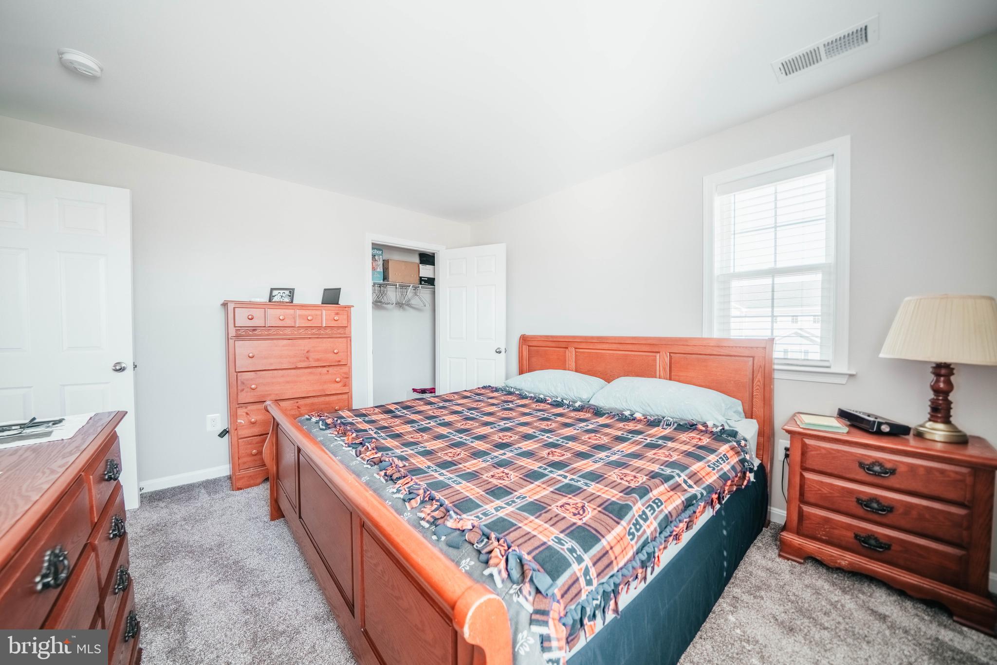 2175 Juniper Drive Culpeper, VA 22701 - Photo 17 of 34 a bedroom with a bed and a dresser in it
