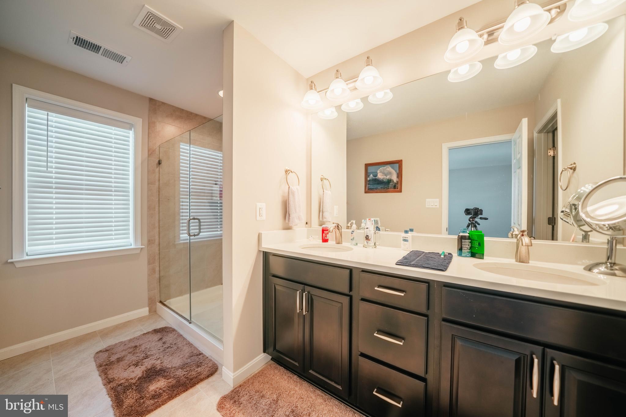 2175 Juniper Drive Culpeper, VA 22701 - Photo 23 of 34 a bathroom with a double vanity sink and a mirror
