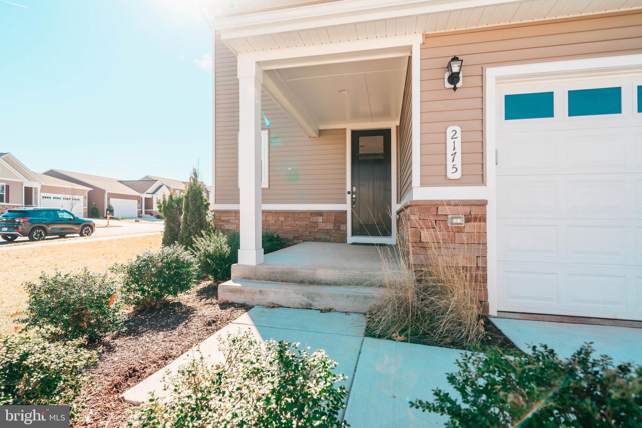 2175 Juniper Drive Culpeper, VA 22701 - Photo 28 of 34 a front view of a house with a yard and garage