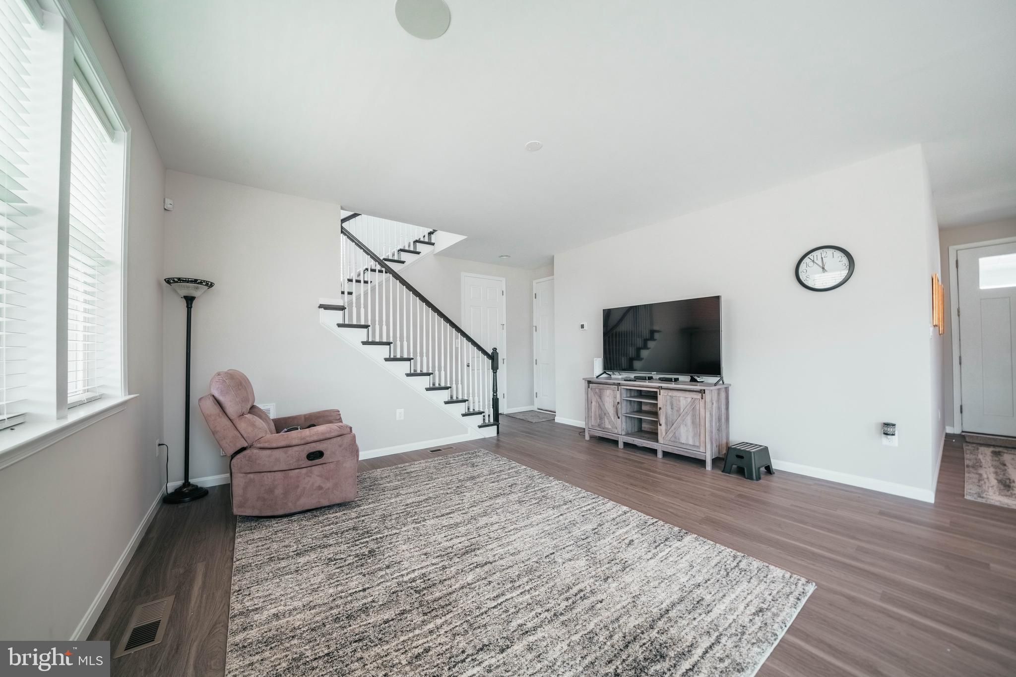 2175 Juniper Drive Culpeper, VA 22701 - Photo 10 of 34 a living room with furniture and a flat screen tv