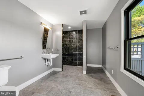 a view of an empty room with a bathroom