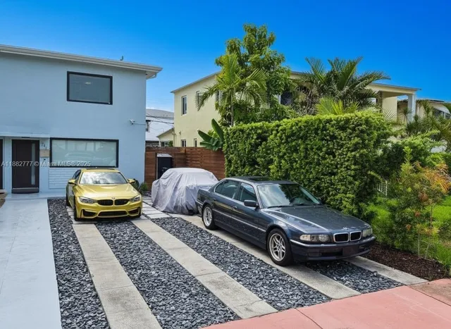 a car parked in front of a house