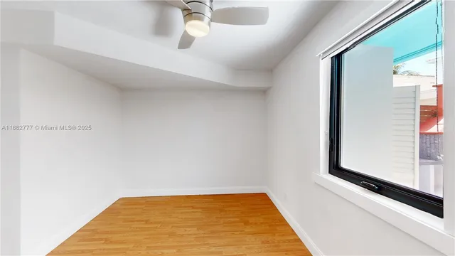 a view of a hallway with a window