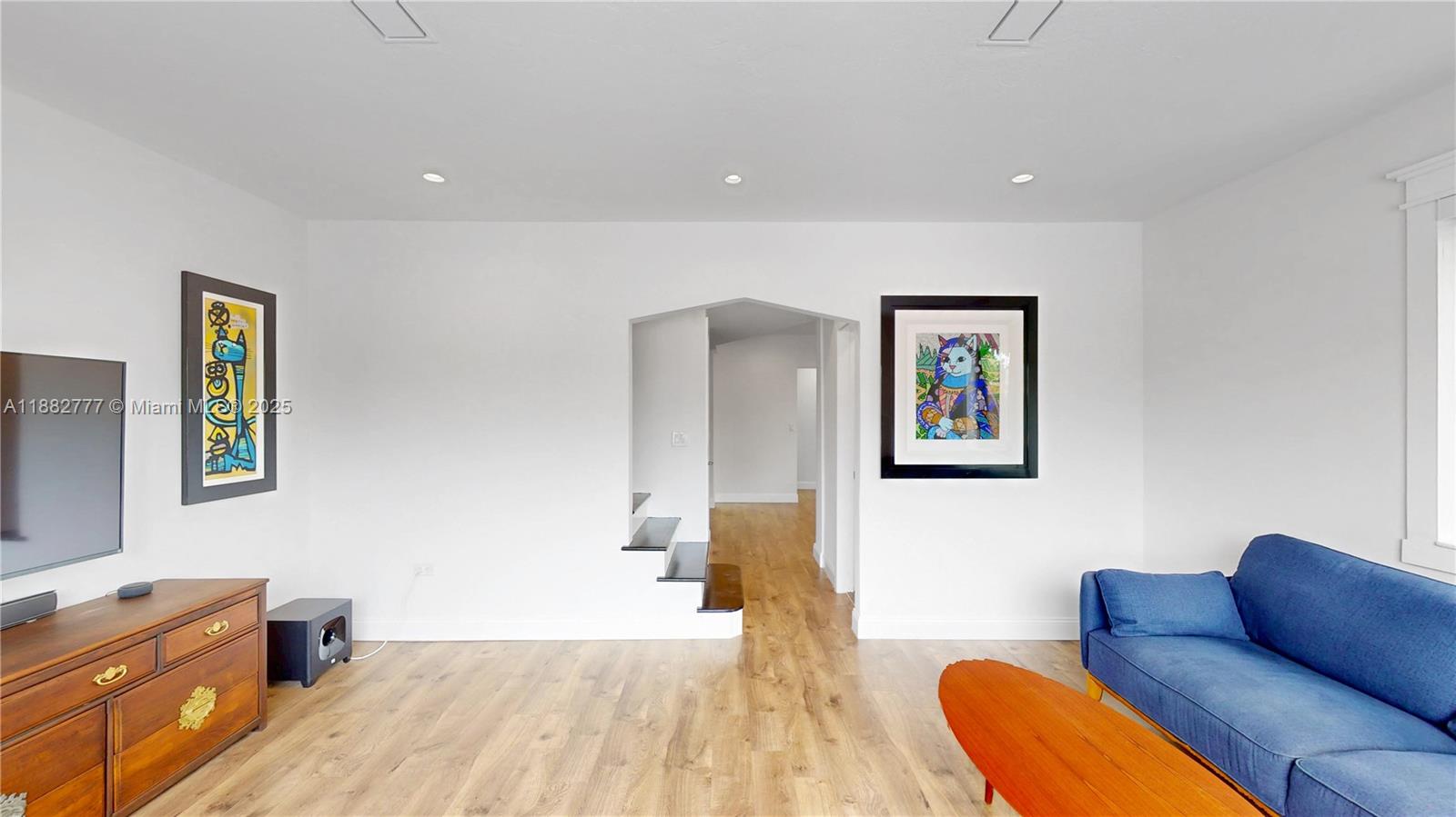 702 86th Street Miami Beach, FL 33141 - Photo 6 of 25 a bedroom with furniture and a couch