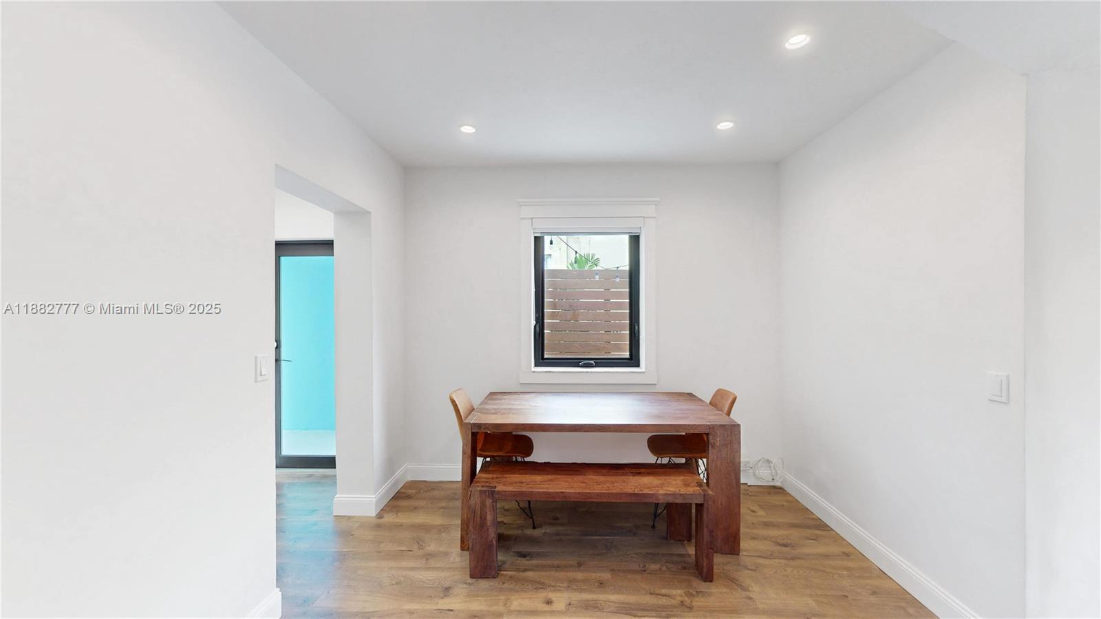 702 86th Street Miami Beach, FL 33141 - Photo 7 of 25 a view of workspace with wooden floor and furniture