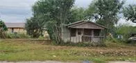 a view of house with trees in the background