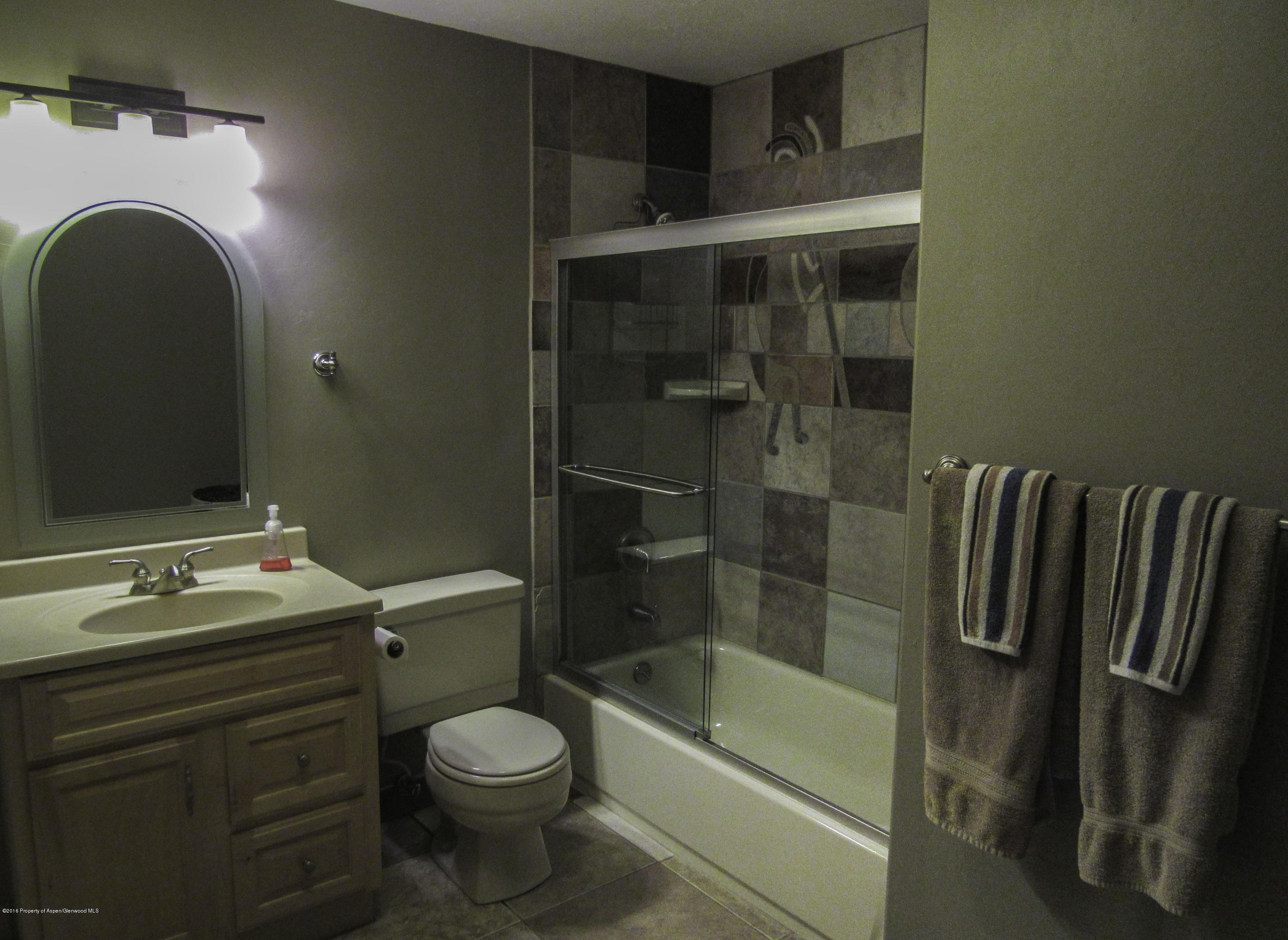 660 Moki Avenue Rifle, CO 81650 - Photo 13 of 25 a bathroom with a sink a toilet and shower
