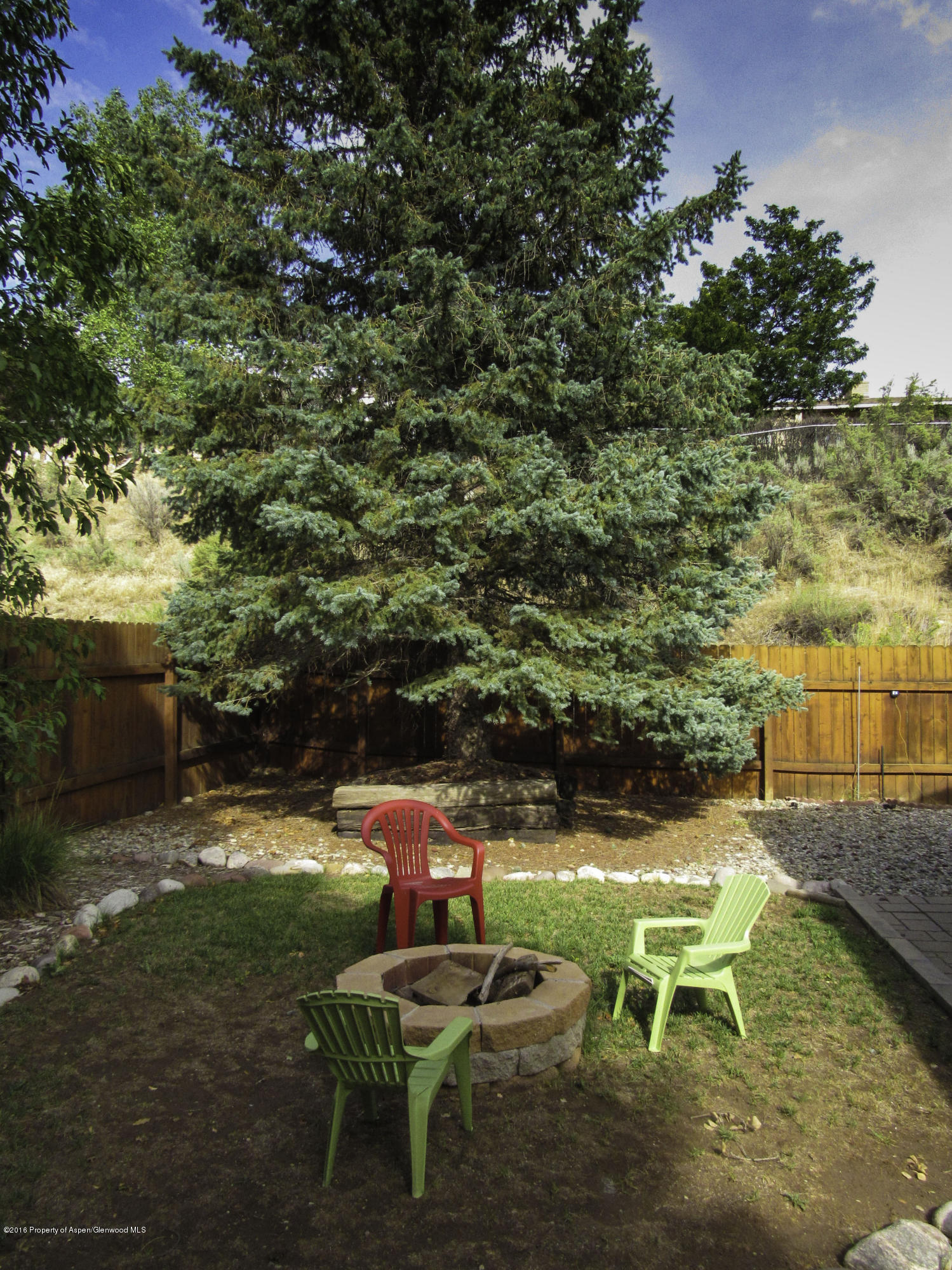 660 Moki Avenue Rifle, CO 81650 - Photo 24 of 25 an outdoor sitting area with swimming pool and green space