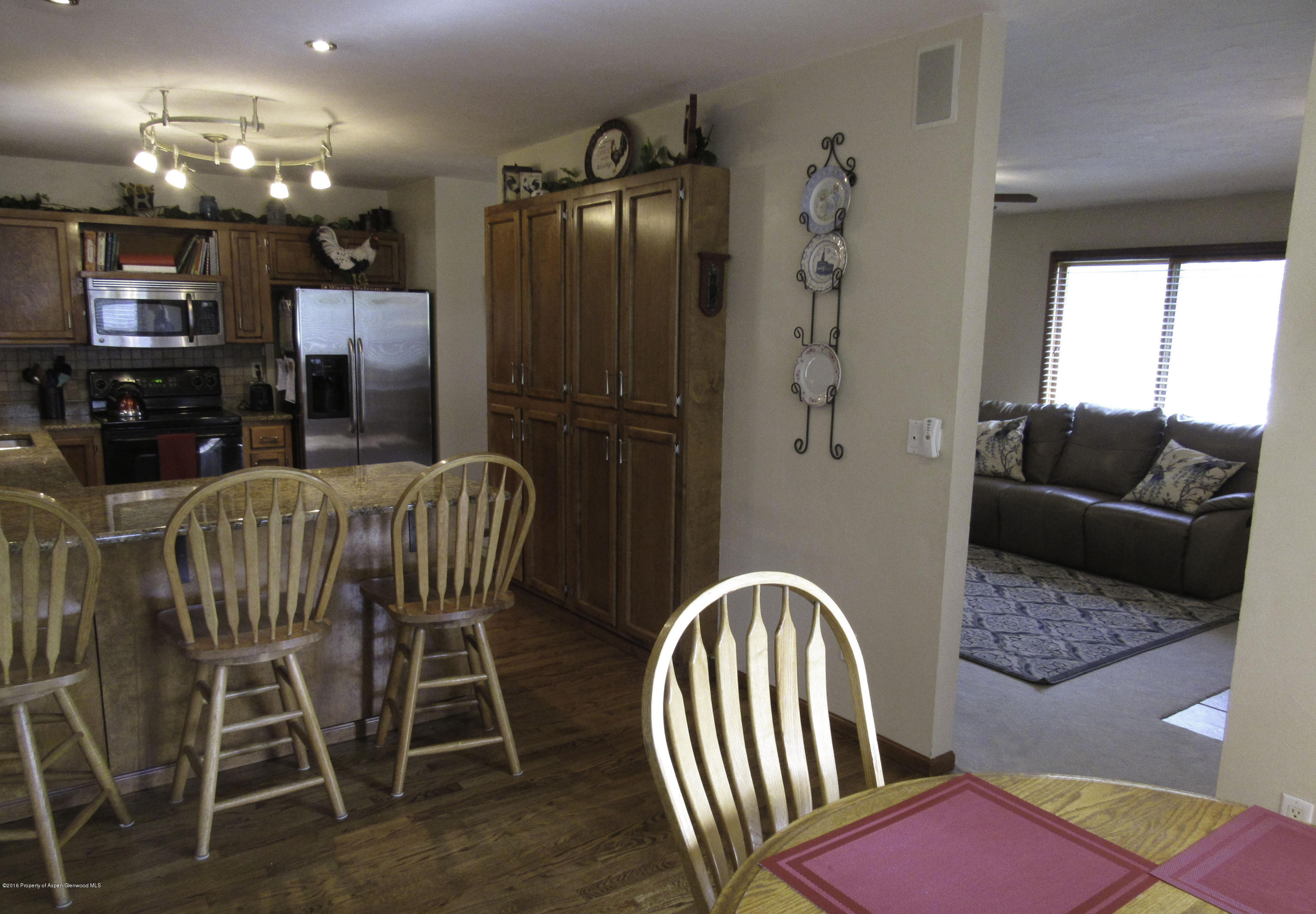 660 Moki Avenue Rifle, CO 81650 - Photo 4 of 25 a view of a dining room with furniture