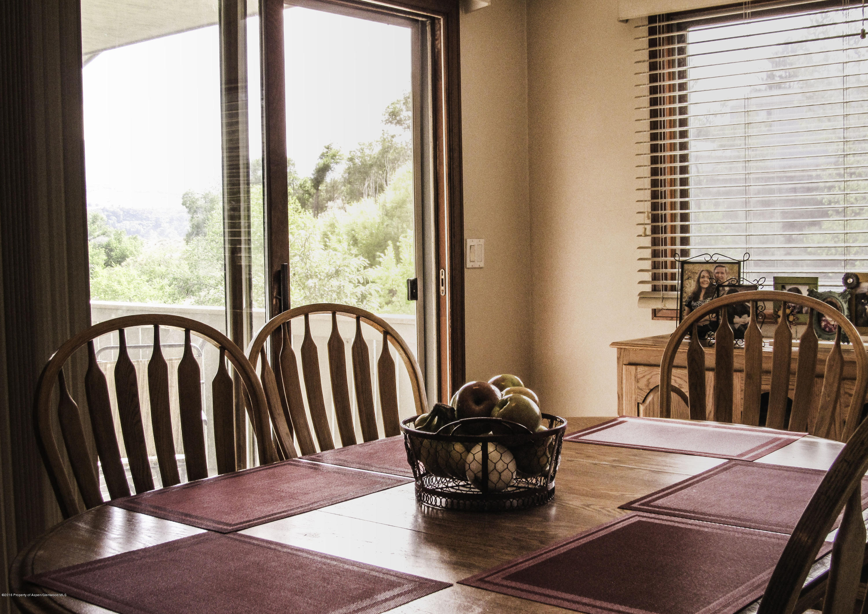 660 Moki Avenue Rifle, CO 81650 - Photo 5 of 25 a view of a dining table and chairs in the balcony