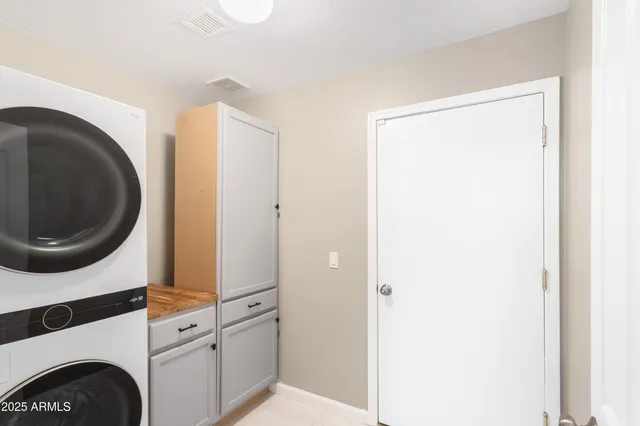 a view of a kitchen with a washer and dryer