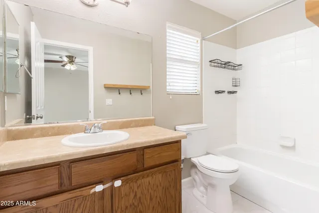 a bathroom with a sink a toilet and a bathtub