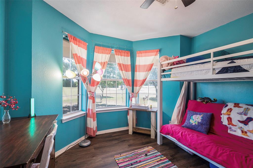 8229 East Lone Oak Road Valley View, TX 76272 - Photo 12 of 22 a living room with furniture and a window