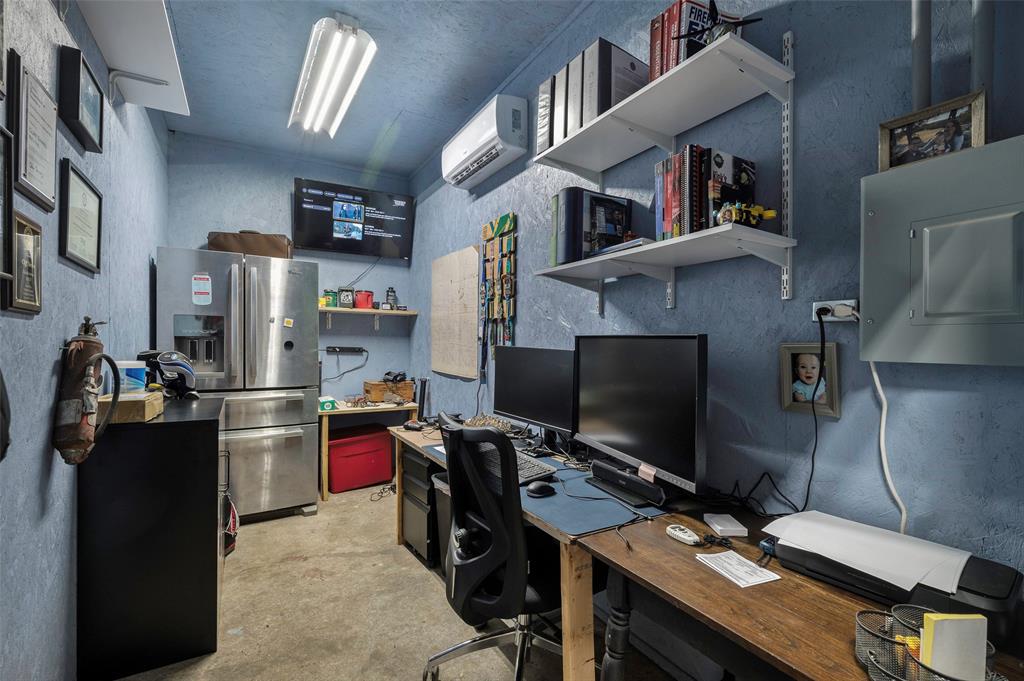 8229 East Lone Oak Road Valley View, TX 76272 - Photo 14 of 22 a view of a workspace with furniture