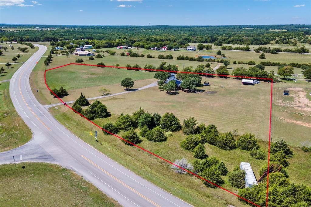 8229 East Lone Oak Road Valley View, TX 76272 - Photo 17 of 22 an aerial view of a house with a garden