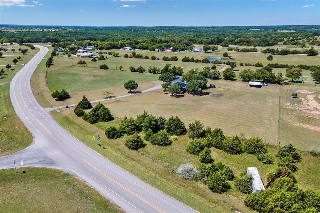 8229 East Lone Oak Road Valley View, TX 76272 - Photo 18 of 22 an aerial view of a house with a garden