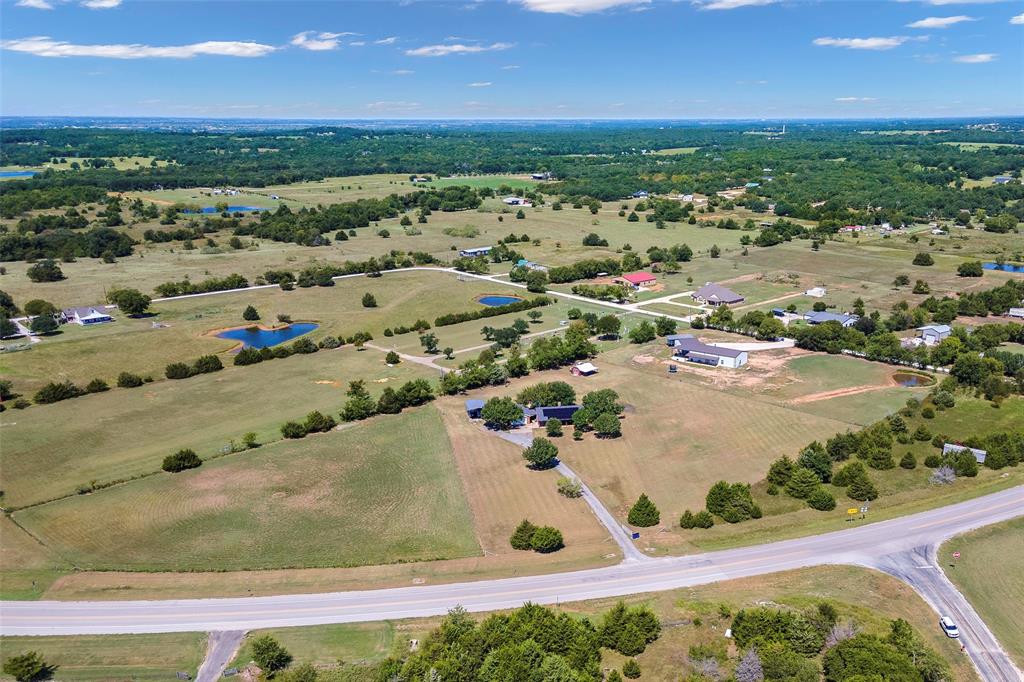 8229 East Lone Oak Road Valley View, TX 76272 - Photo 21 of 22 an aerial view of residential houses with outdoor space