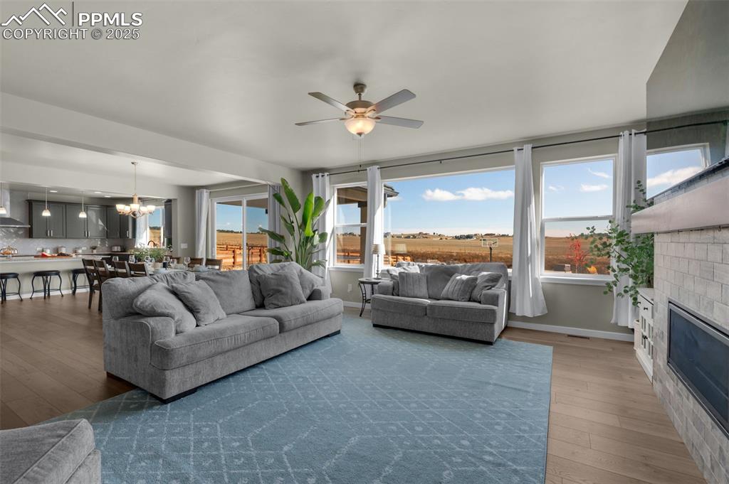 9755 Owl Perch Loop Colorado Springs, CO 80908 - Photo 13 of 50 a living room with furniture and a large window