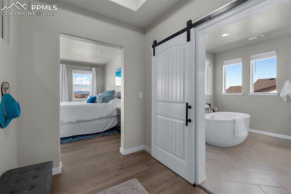 9755 Owl Perch Loop Colorado Springs, CO 80908 - Photo 19 of 50 a bathroom with a bathtub and a toilet