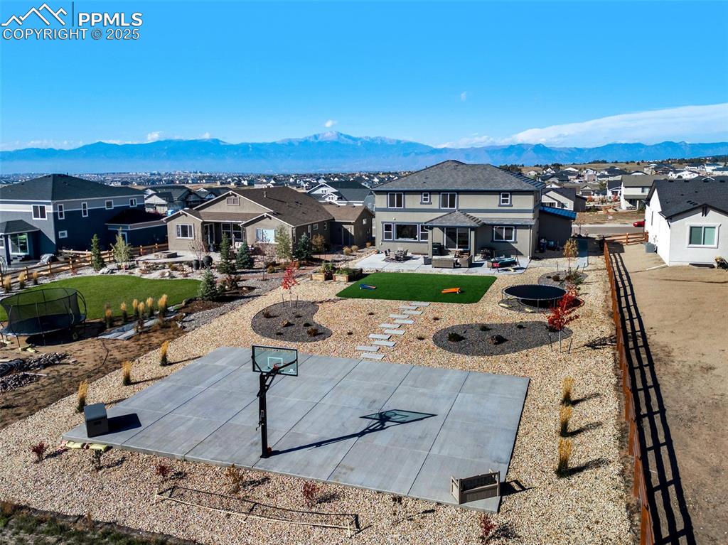 9755 Owl Perch Loop Colorado Springs, CO 80908 - Photo 2 of 50 a view of a terrace with a garden and cars